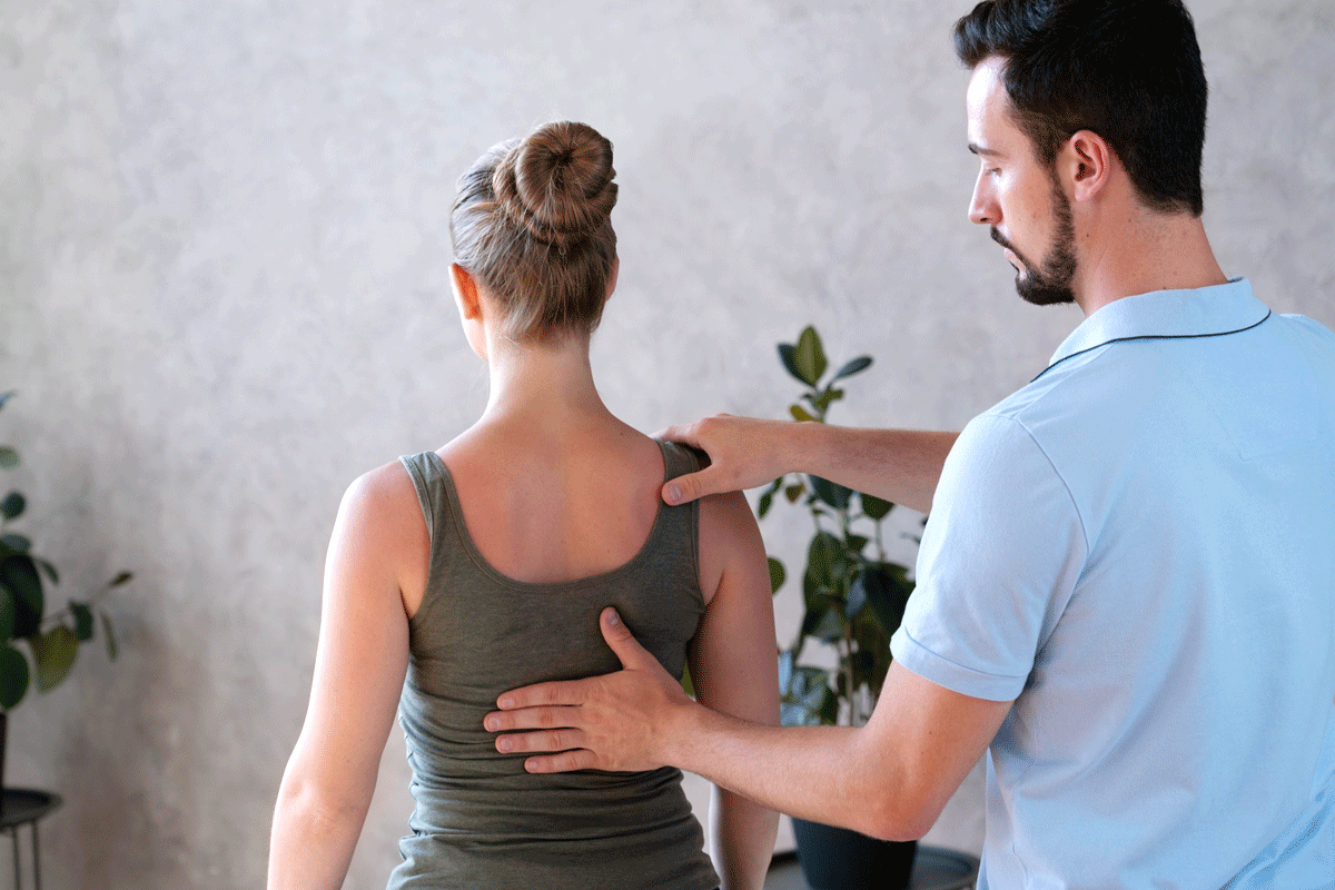 Woman experiencing the benefits of chiropractic care in Wichita, Kansas